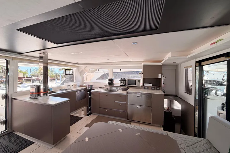 Slide: The Image of Luxurious interior of a 2023 Leopard 50 yacht featuring modern kitchen and sleek design. - 11