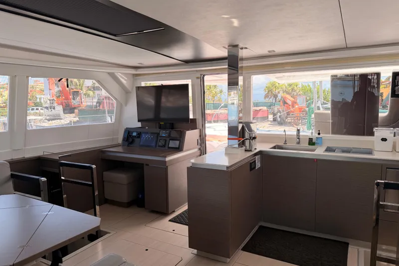 Slide: The Image of Modern interior of 2023 Leopard 50 yacht with sleek kitchen and navigation area. - 12