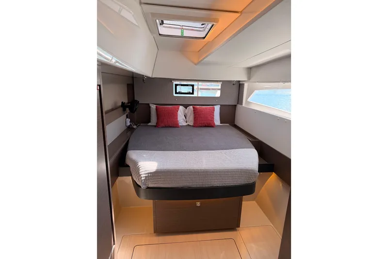 Slide: The Image of Luxurious cabin interior of 2023 Leopard 50 yacht with modern bedding and natural light. - 19