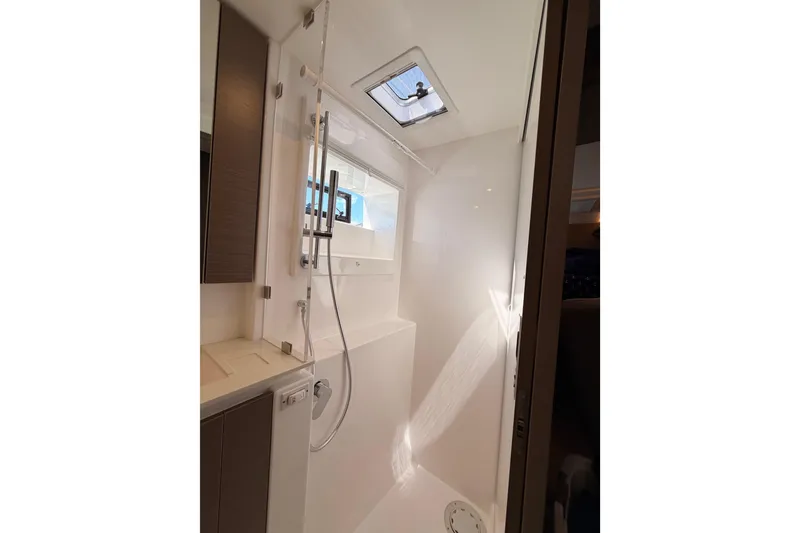 Slide: The Image of Modern shower area in 2023 Leopard 50 yacht, featuring sleek design and natural lighting. - 20