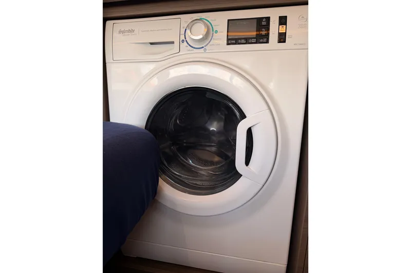 Slide: The Image of Front-loading washing machine, Leopard 50 model, 2023, with digital controls and sleek design. - 23