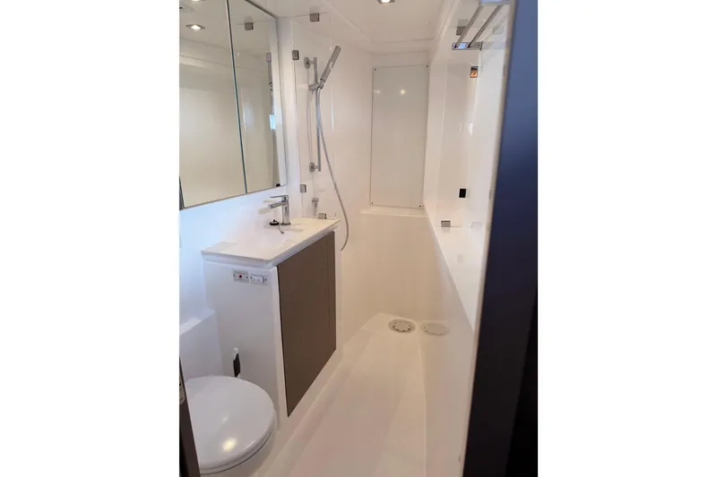 Slide: The Image of Modern bathroom interior on Leopard 50 yacht, featuring sleek fixtures and minimalist design, 2023 model. - 25