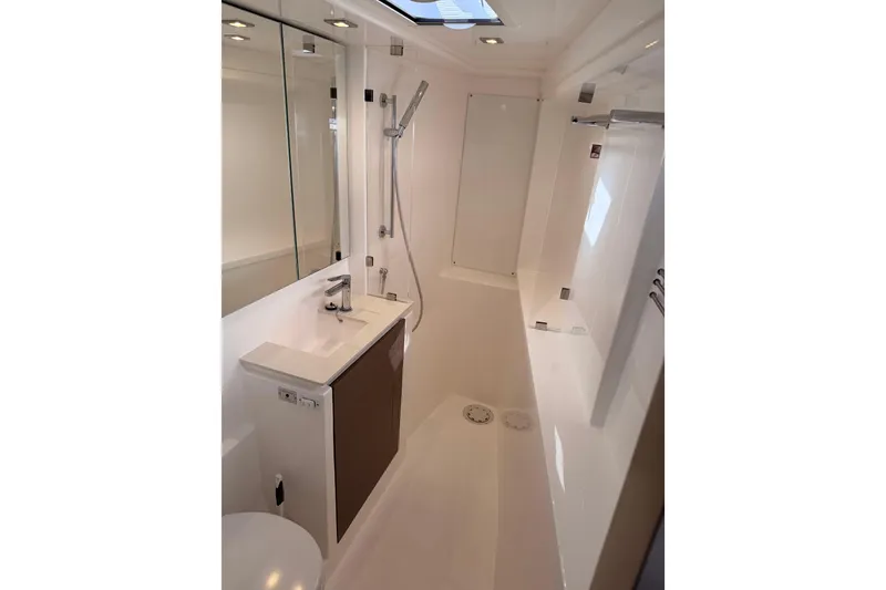 Slide: The Image of Modern bathroom interior on a 2023 Leopard 50 yacht, featuring sleek fixtures and a shower. - 27