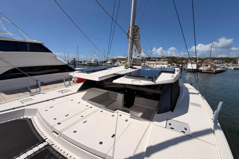Slide: The Image of 2023 Leopard 50 yacht docked at marina under clear blue sky. - 30