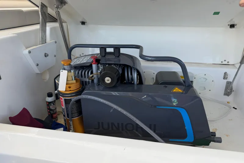 Slide: The Image of Engine compartment of a 2023 Leopard 50 yacht, featuring mechanical components and storage. - 34