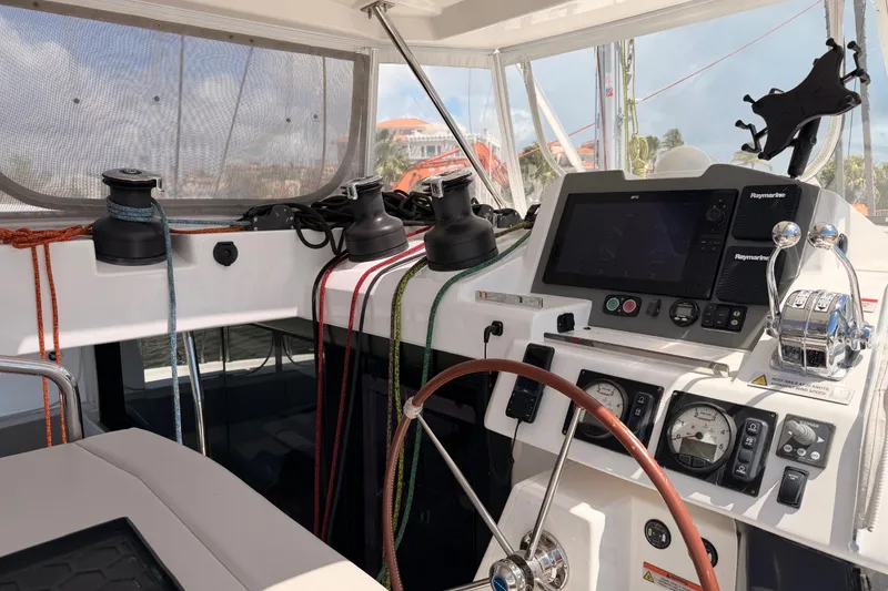 Slide: The Image of Helm of 2023 Leopard 50 yacht with navigation controls and winches. - 6