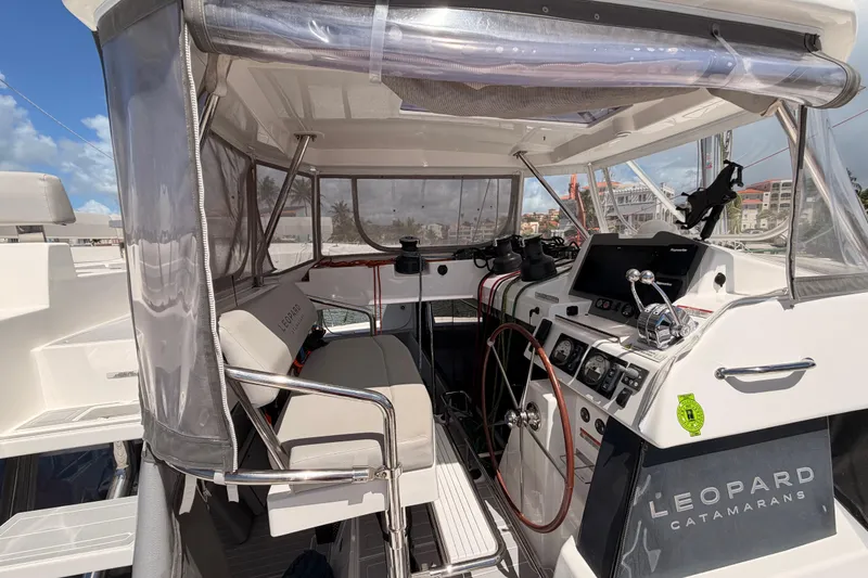 Slide: The Image of Helm of 2023 Leopard 50 catamaran with modern navigation equipment and steering wheel. - 7