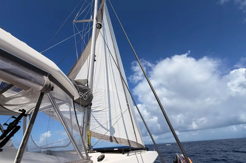 Slide: The Image of Sailing on a 2023 Leopard 50 catamaran under clear blue skies. - 8