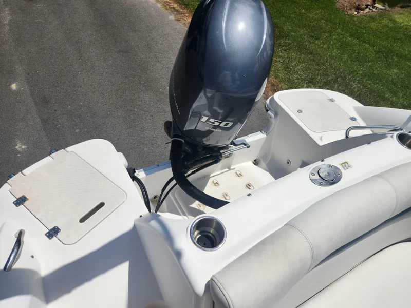 Slide: The Image of 2013 Hurricane SunDeck 2200 OB boat with 150 HP outboard motor. - 11