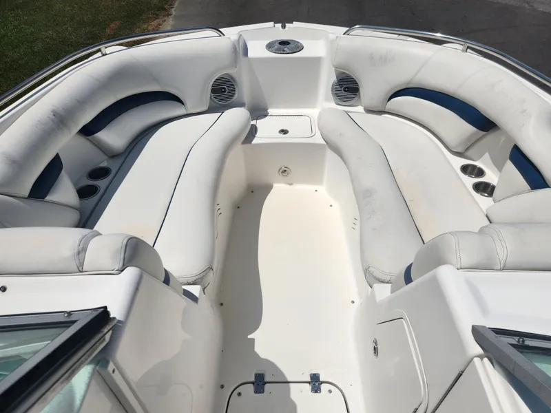 Slide: The Image of 2013 Hurricane SunDeck 2200 OB boat interior with white and blue seating. - 5