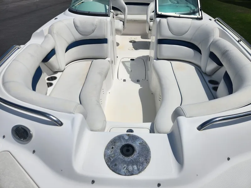 Slide: The Image of 2013 Hurricane SunDeck 2200 OB boat interior with white and blue seating. - 6