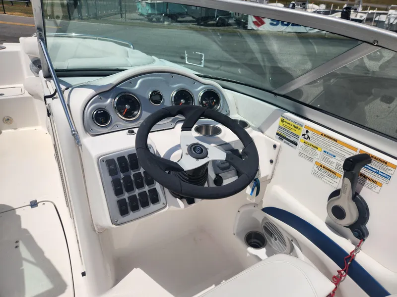 Slide: The Image of 2013 Hurricane SunDeck 2200 OB boat dashboard and steering wheel. - 7