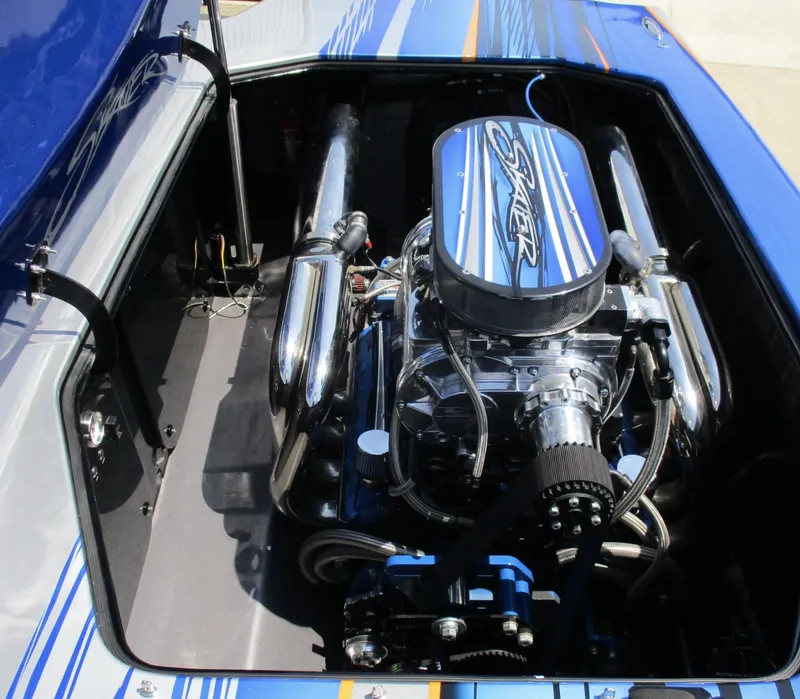 Slide: The Image of 2002 Skater 46 boat engine compartment with chrome details. - 12