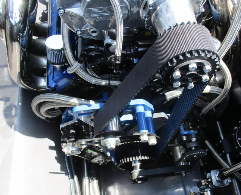 Slide: The Image of Close-up of a 2002 Skater 46 engine with supercharger and belt drive system. - 13
