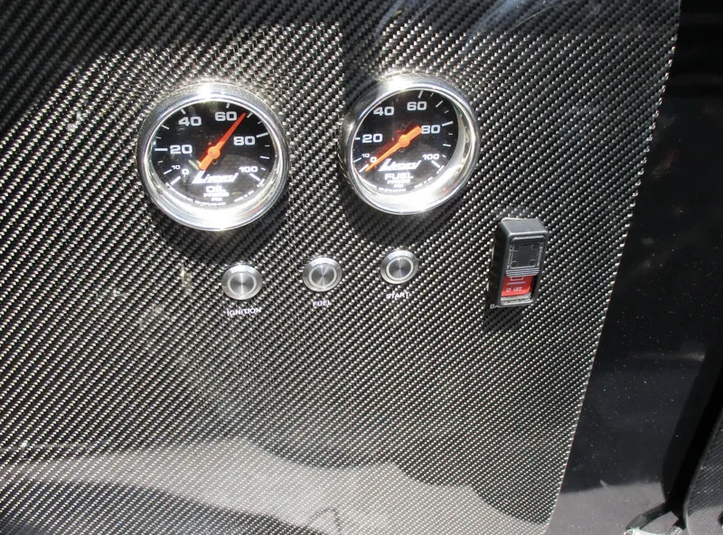 Slide: The Image of Carbon fiber dashboard with gauges and switches, Skater 46 model, 2002. - 15