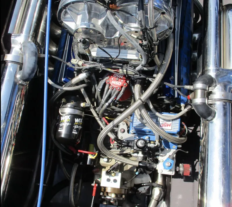 Slide: The Image of Close-up of a 2002 Skater 46 engine with visible wiring and components. - 17