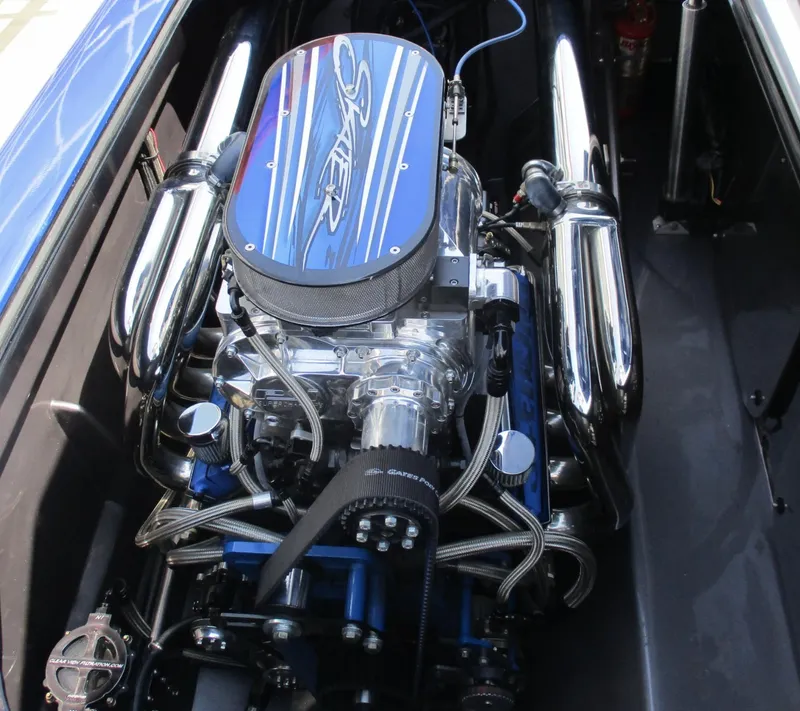 Slide: The Image of 2002 Skater 46 engine with chrome components and blue accents. - 18