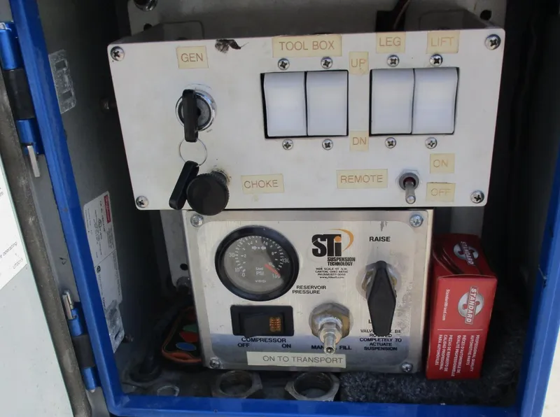 Slide: The Image of Control panel of Skater 46 model, 2002, with various switches and gauges. - 19