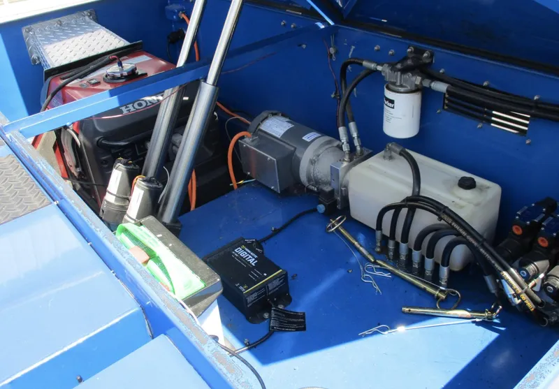 Slide: The Image of Engine compartment of a 2002 Skater 46 boat with Honda generator and hydraulic system. - 20