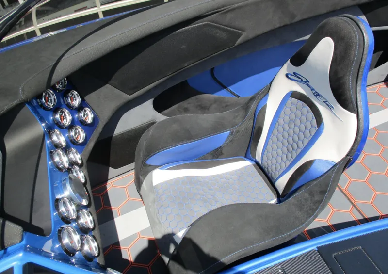 Slide: The Image of Interior of a 2002 Skater 46 boat with a modern cockpit and racing seat. - 3