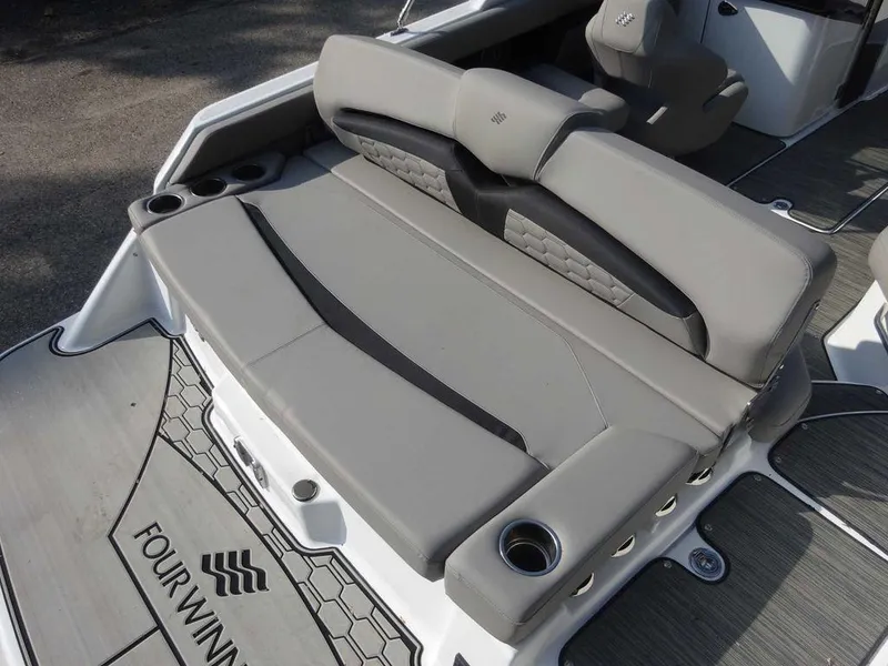 Slide: The Image of 2023 Four Winns HD3 boat with gray seating and cup holders. - 1