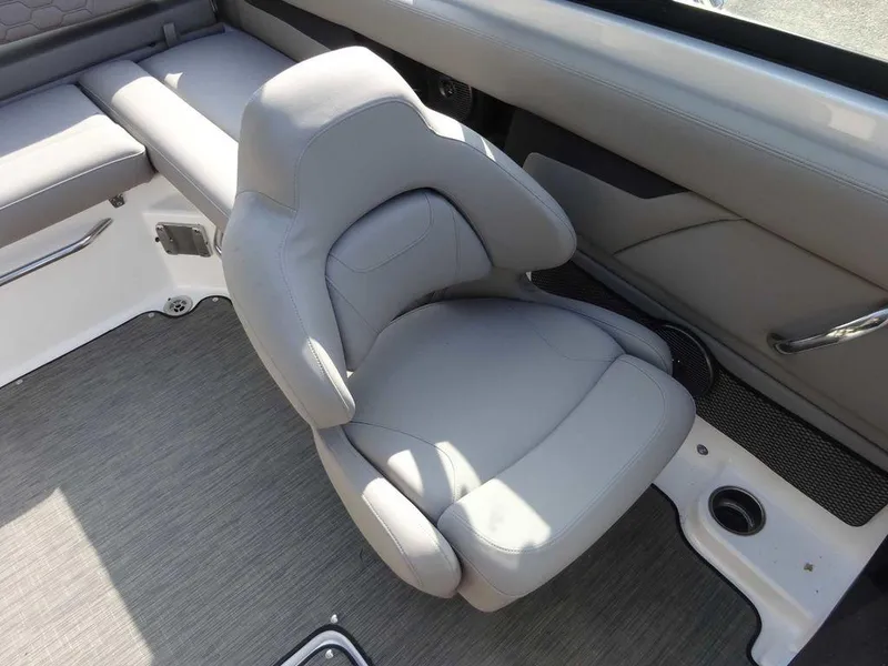 Slide: The Image of 2023 Four Winns HD3 boat interior with gray cushioned seating. - 10