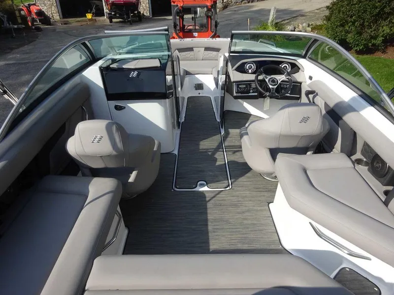 Slide: The Image of 2023 Four Winns HD3 boat interior with modern seating and dashboard. - 18