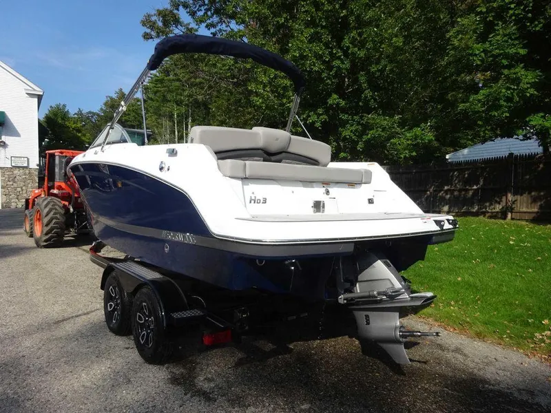 Slide: The Image of 2023 Four Winns HD3 boat on a trailer, rear view. - 19