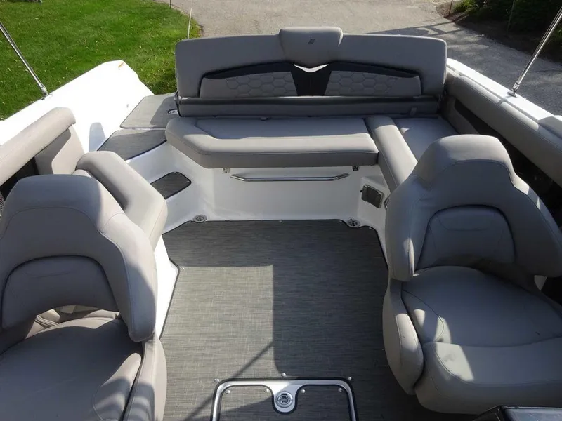 Slide: The Image of 2023 Four Winns HD3 boat interior with gray seating and spacious layout. - 4