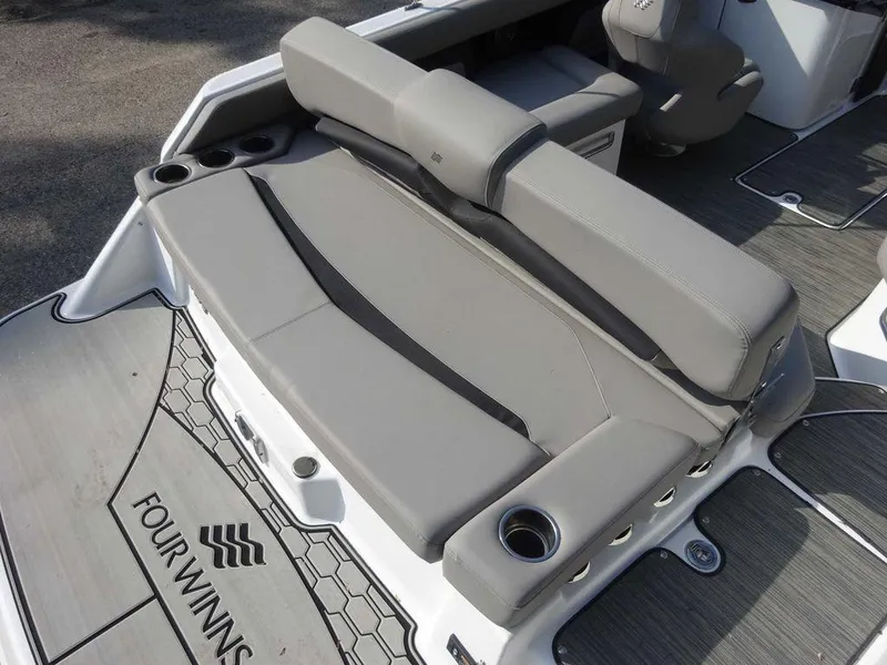 Slide: The Image of 2023 Four Winns HD3 boat with gray seating and cup holders. - 6