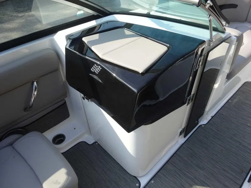 Slide: The Image of 2023 Four Winns HD3 boat interior with seating and storage compartment. - 8