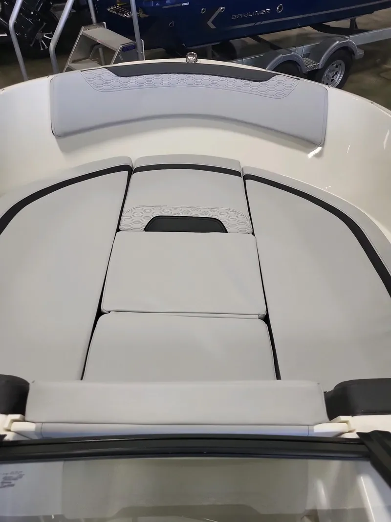 Slide: The Image of 2023 Bayliner Element M17 boat interior with cushioned seating. - 3