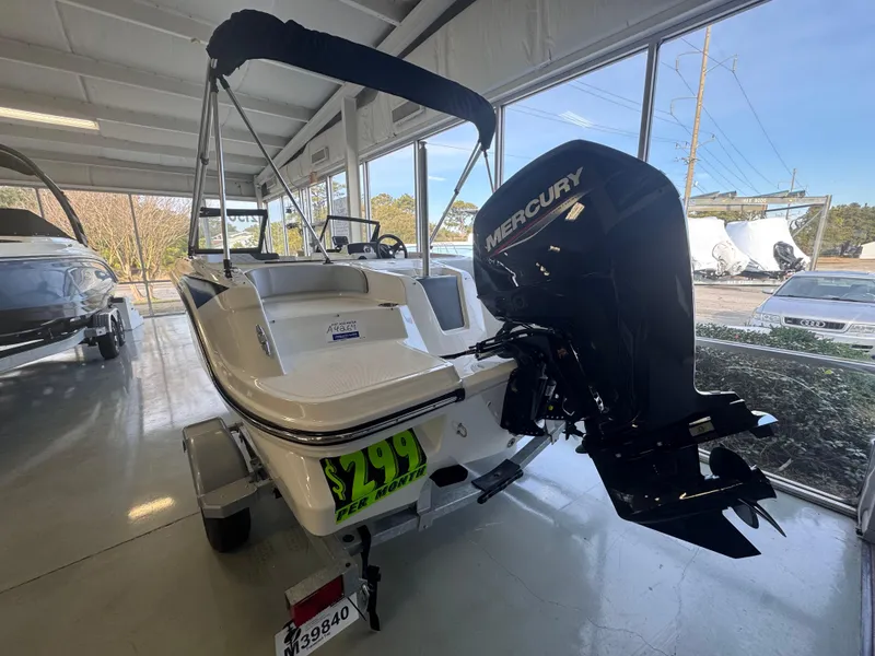 Slide: The Image of 2023 Bayliner Element M17 boat with Mercury engine in showroom. - 4