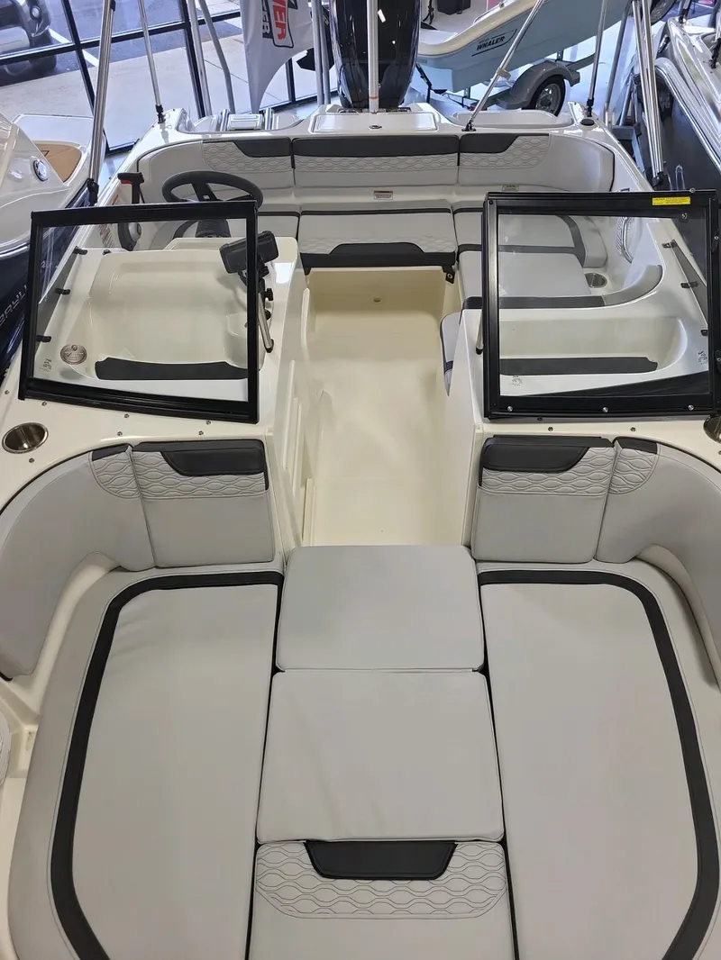 Slide: The Image of 2023 Bayliner Element M17 boat interior with seating and open windshield. - 5