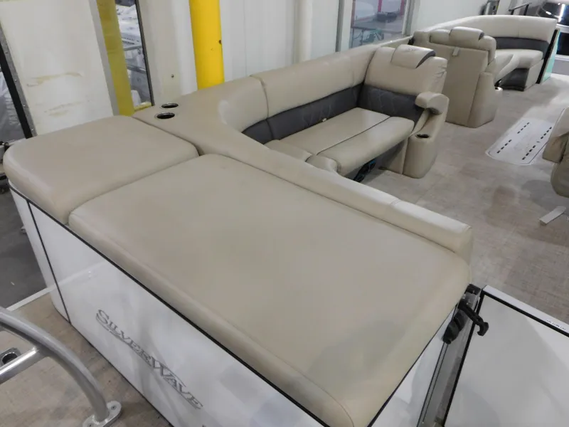 Slide: The Image of 2023 Silver Wave 2410 SW5 L pontoon boat interior with beige seating. - 10