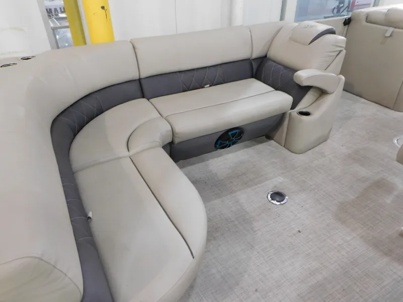 Slide: The Image of 2023 Silver Wave 2410 SW5 L boat interior with beige and gray seating. - 7