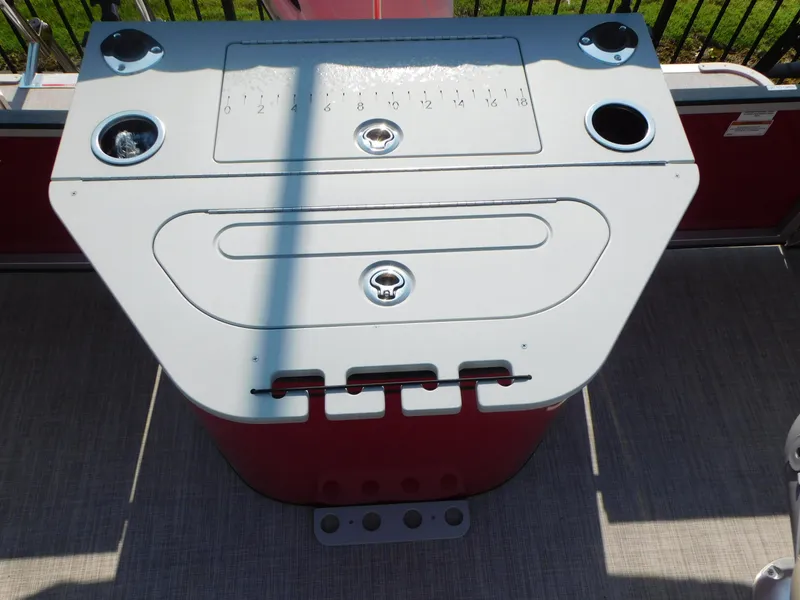 Slide: The Image of 2023 Silver Wave 2210 SW3 RLP boat console with cup holders and storage compartments. - 6