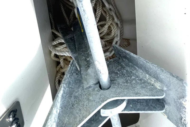 Slide: The Image of Anchor and ropes in the storage compartment of a 2022 Monterey M225 boat. - 16