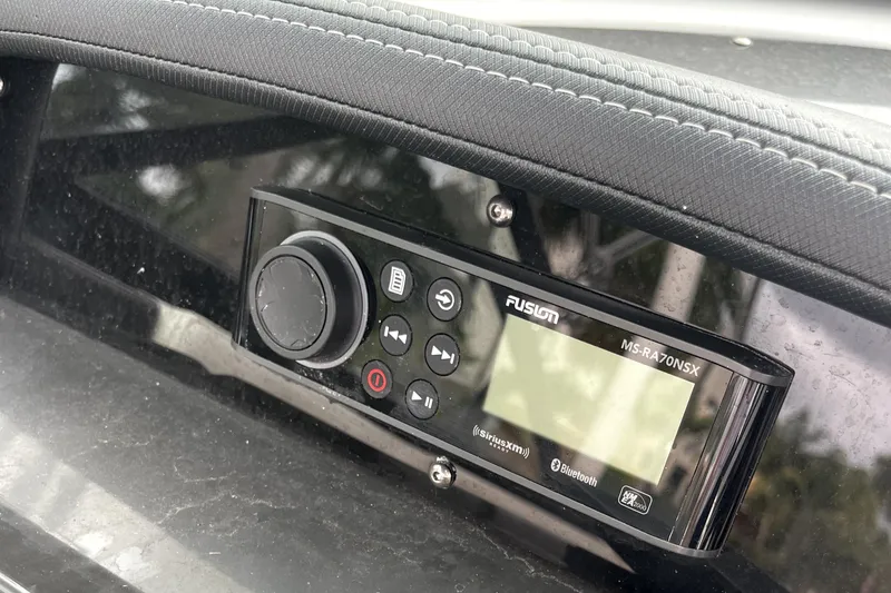 Slide: The Image of Fusion MS-RA70NSX marine stereo on a 2022 Monterey M225 boat dashboard. - 20