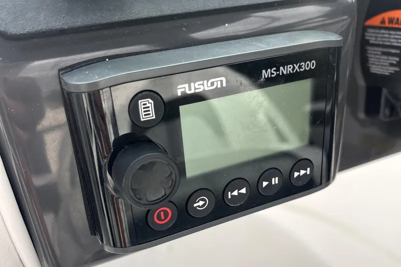 Slide: The Image of Fusion MS-NRX300 marine stereo control on 2022 Monterey M225 boat. - 26