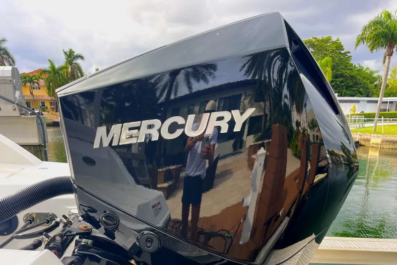 Slide: The Image of Close-up of a 2022 Monterey M225 boat with a Mercury outboard motor. - 29
