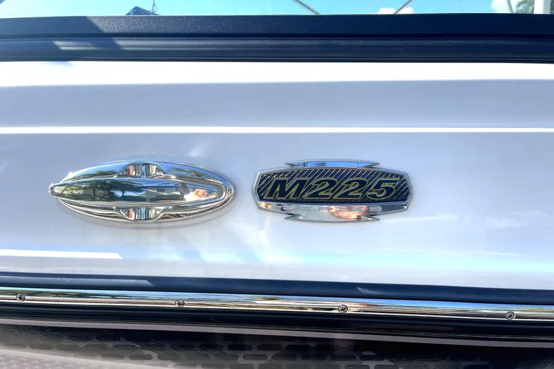 Slide: The Image of 2022 Monterey M225 boat emblem and model badge. - 6