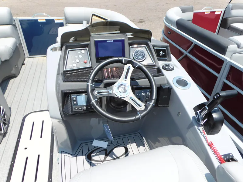 Slide: The Image of 2023 Veranda VTX22RC boat dashboard with steering wheel and control panel. - 12