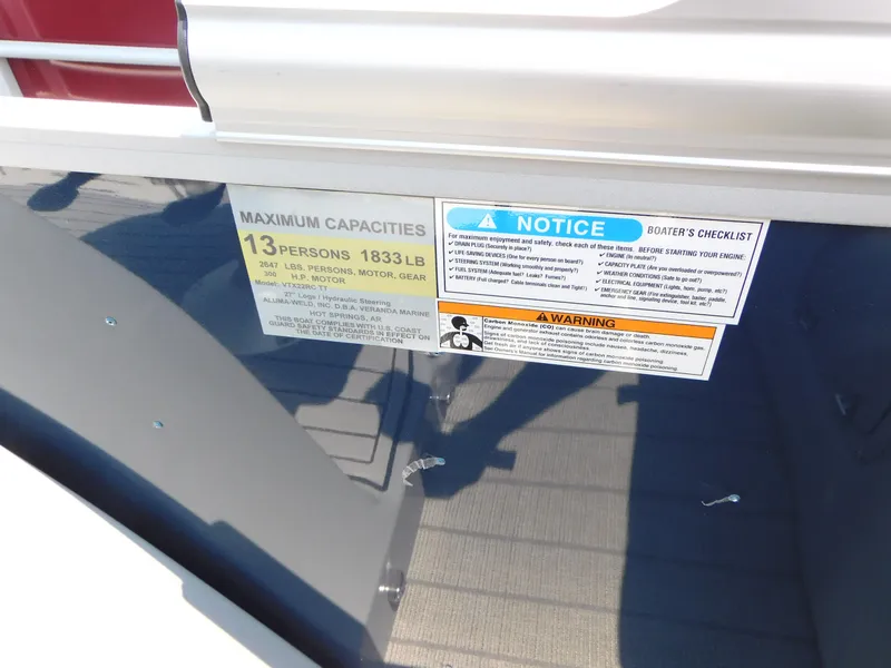 Slide: The Image of 2023 Veranda VTX22RC capacity and safety labels, maximum 13 persons or 1833 lbs. - 13
