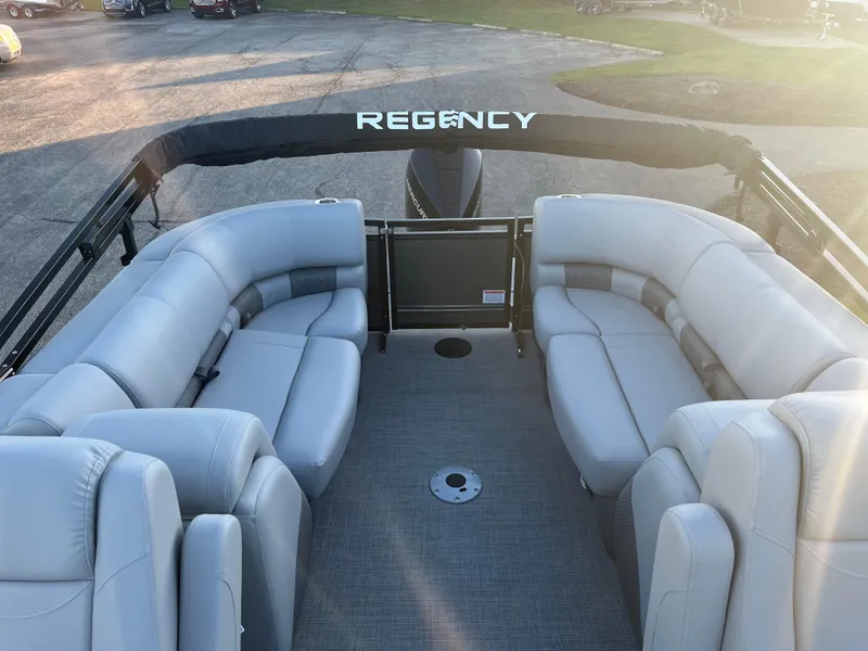 Slide: The Image of 2023 Regency 250 LE3 pontoon boat with spacious seating and canopy. - 3