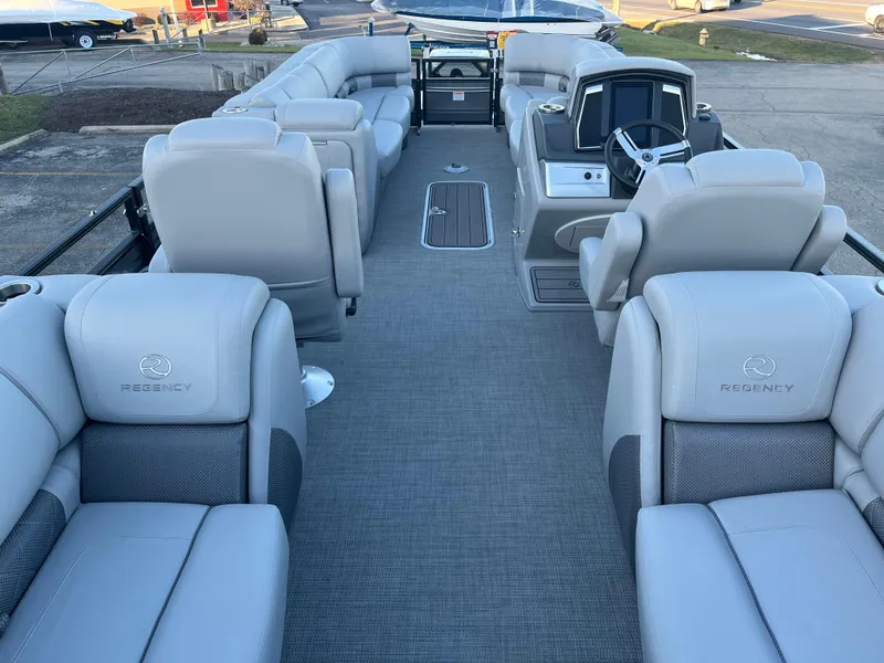 Slide: The Image of 2023 Regency 250 LE3 pontoon boat interior with luxurious seating. - 5
