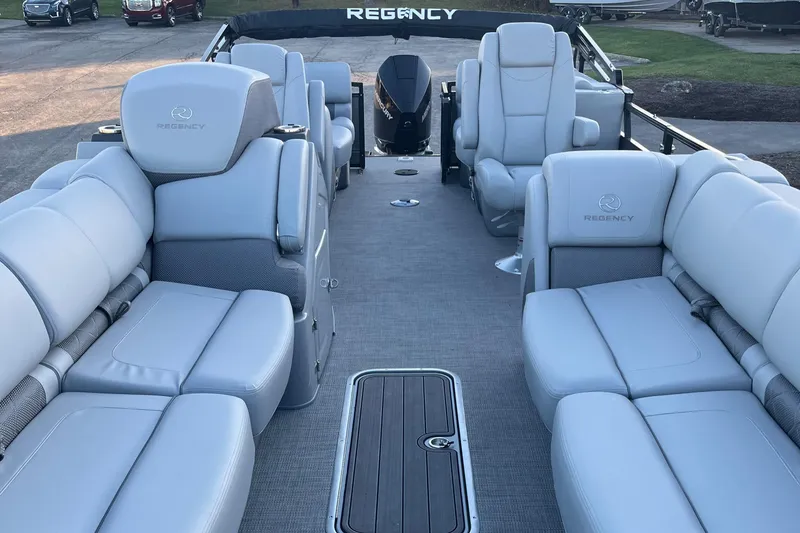 Slide: The Image of 2023 Regency 250 LE3 pontoon boat with luxurious seating and spacious deck. - 8