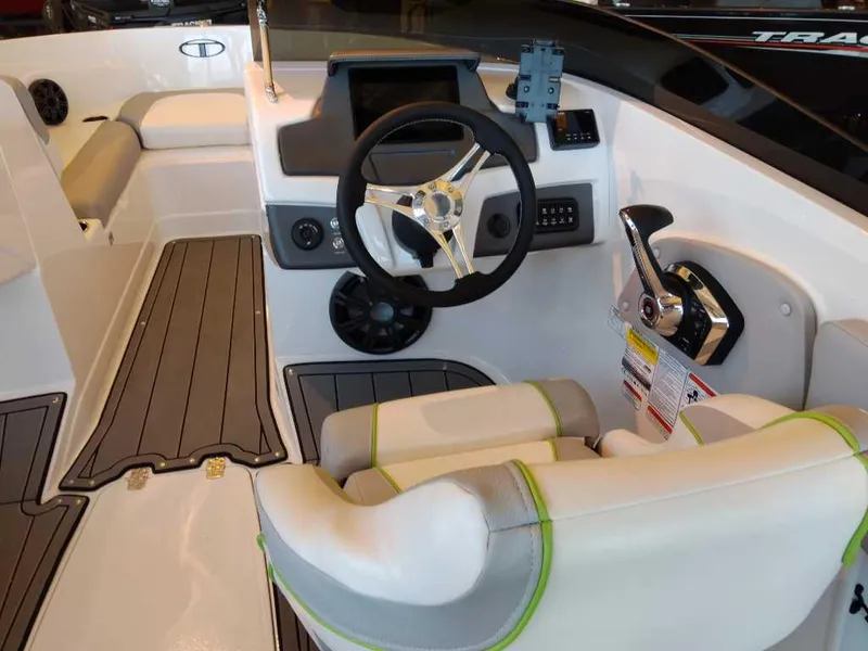 Slide: The Image of 2023 Tahoe 210 Si Limited boat interior with steering wheel and control panel. - 6