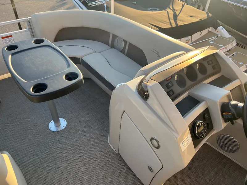 Slide: The Image of 2019 Bennington 22 SSRX boat interior with seating and control console. - 16