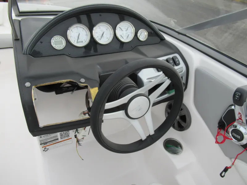 Slide: The Image of 2019 Regal 1900 ES Bowrider dashboard with steering wheel and gauges. - 13